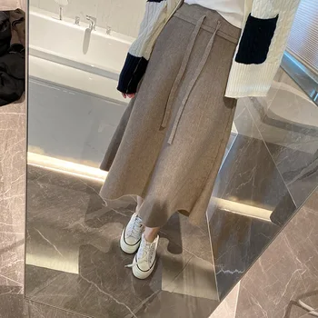 Корейская версия верхней юбки 2023, осенне-зимняя новая модная однотонная трикотажная юбка с эластичной резинкой на талии.